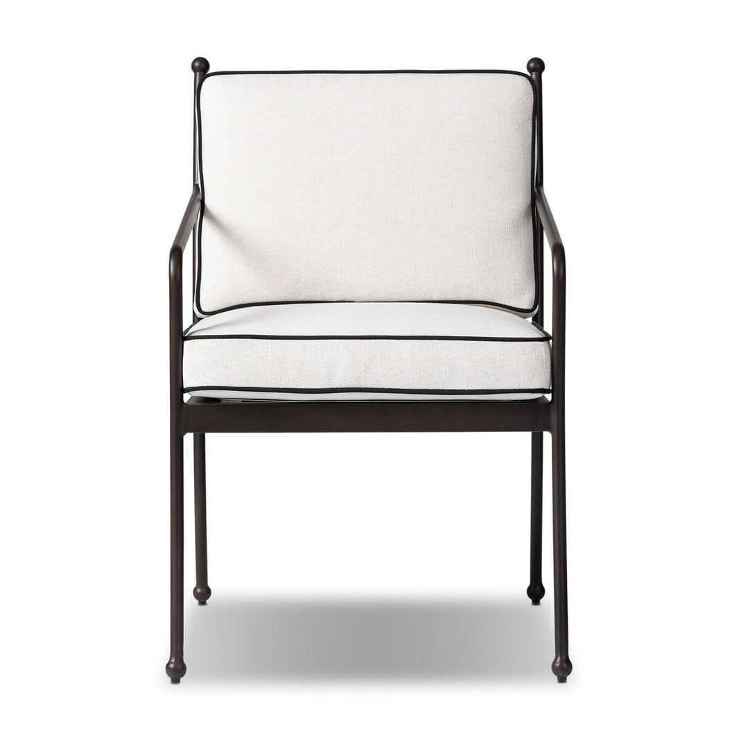 The French Deco Outdoor Dining Chair features a black metal frame with a white cushioned seat and backrest, accented by black piping, and is displayed against a plain white background.