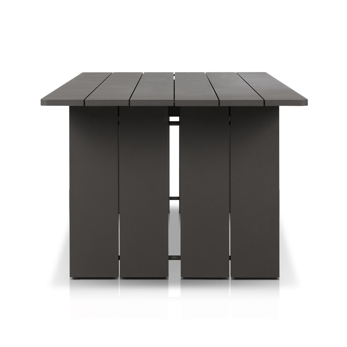 The Outdoor Metal Dining Table seats eight comfortably and features a dark gray finish, slatted top, wide flat panel legs, and a sturdy metal frame. Shown from the end against a white background.