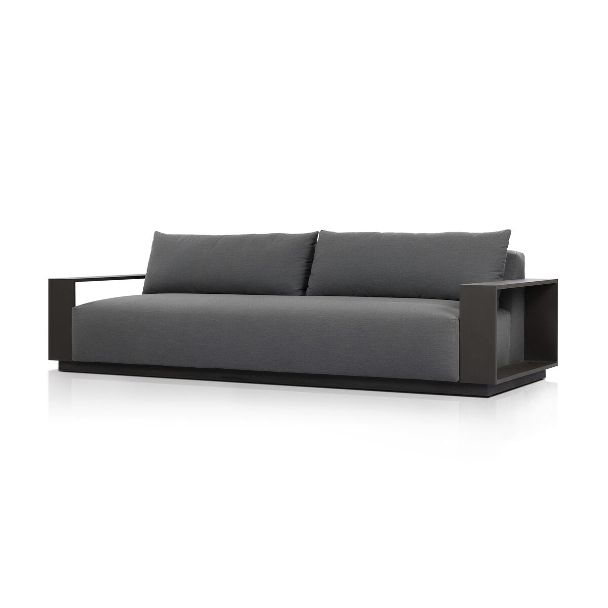 The Heavy Metal Framed Outdoor Sofa features thick dark gray cushions, a black metal frame, wide flat armrests, and a sleek minimalist design, all set against a white background.