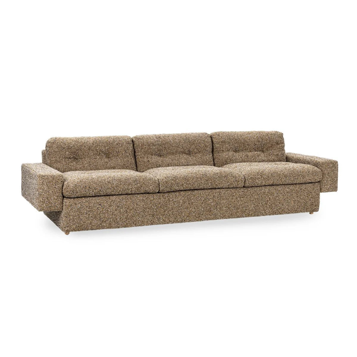 The Tufted Sofa is a long, three-seat mid-century piece with a low back, wide armrests, and textured brown upholstery, shown against a white background.