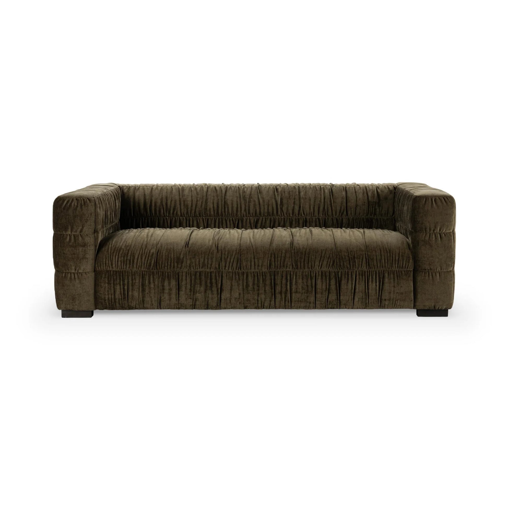 The Ruched Upholstered Sofa features dark brown velvet, a low back and arms, gathered fabric texture, and block-style legs, offering modern artistry and elegance.