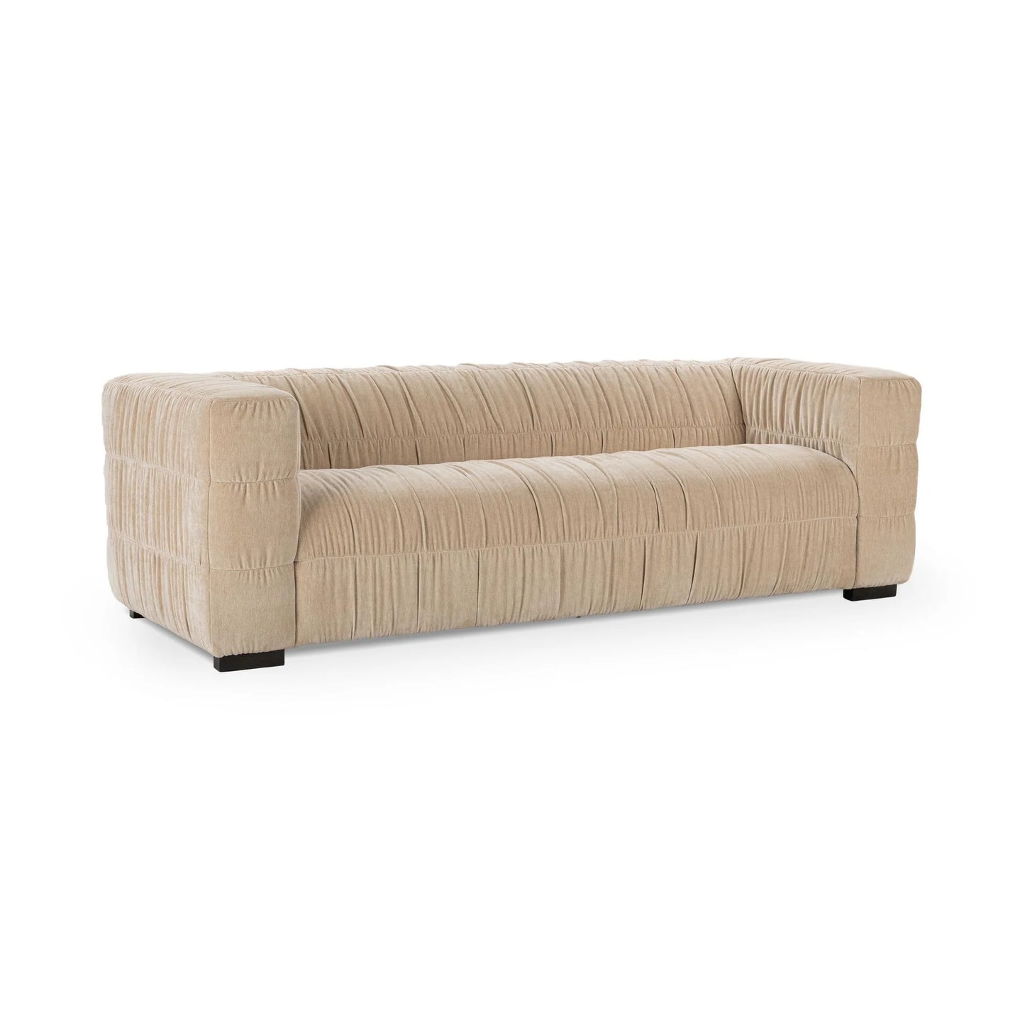 The Ruched Upholstered Sofa features a modern beige design with wide armrests, low back, pleated fabric texture, luxury upholstery, short dark legs, and a minimalist rectangular silhouette for true modern style.