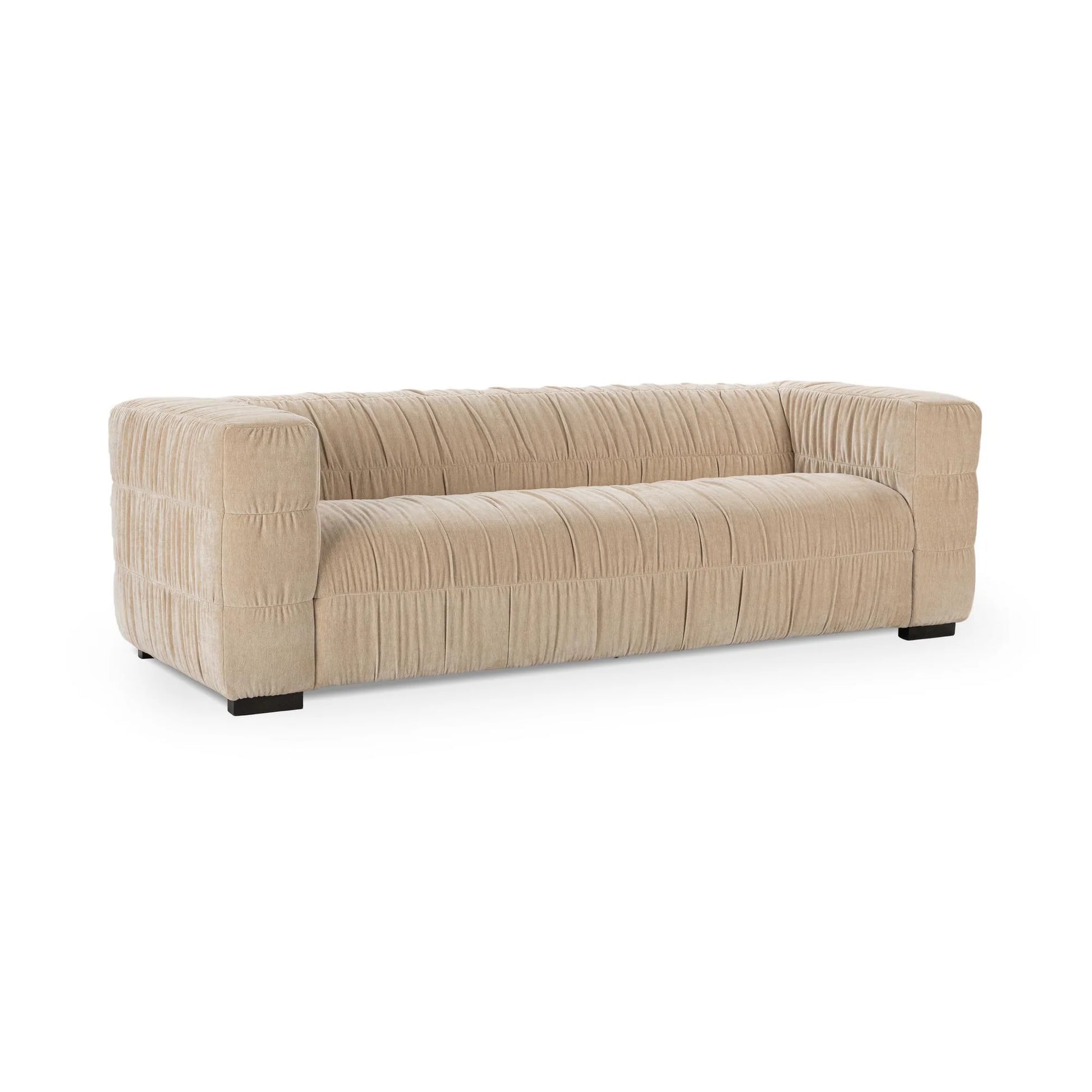 The Ruched Upholstered Sofa features a modern beige design with wide armrests, low back, pleated fabric texture, luxury upholstery, short dark legs, and a minimalist rectangular silhouette for true modern style.