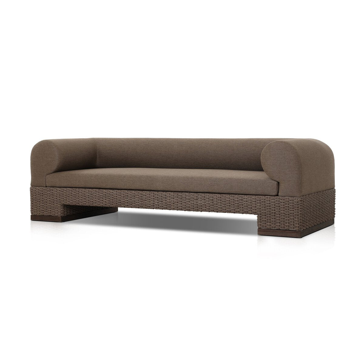 The Wicker Base Outdoor Sofa features a modern brown design with rounded armrests, a flat backrest, and UV-resistant cushions—ideal for stylish outdoor seating against a plain white background.