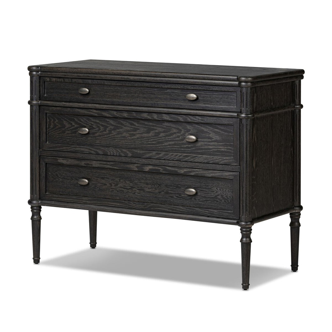 The European 3 Drawer Dresser features a dark oak veneer, three distressed black drawers with round metal knobs, and slender turned legs. Its classic design and smooth finish add antique European elegance to any bedroom.