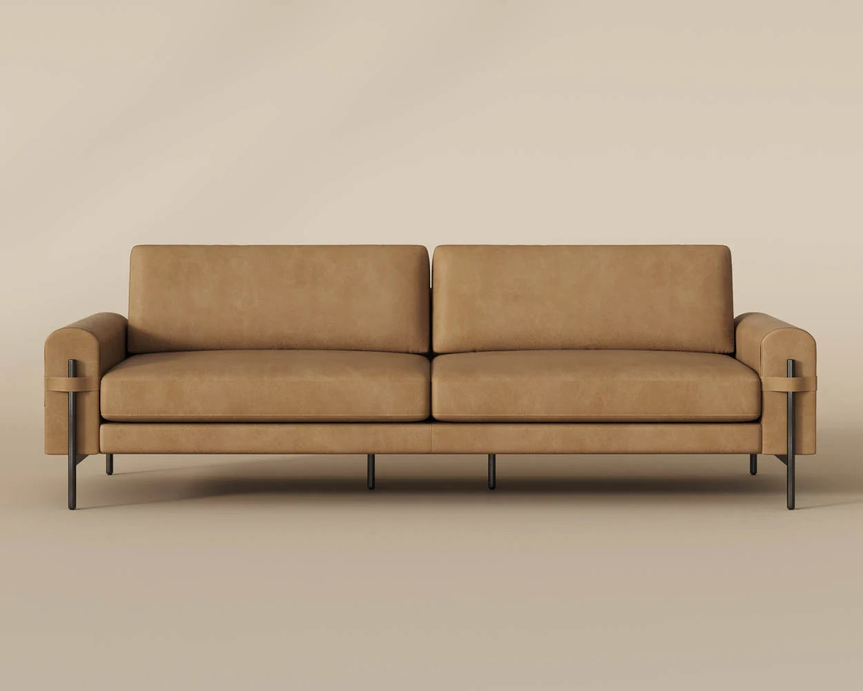 A contemporary Leather Strap Sofa in sesame leather with square cushions and slim black metal legs, displayed against a beige background.