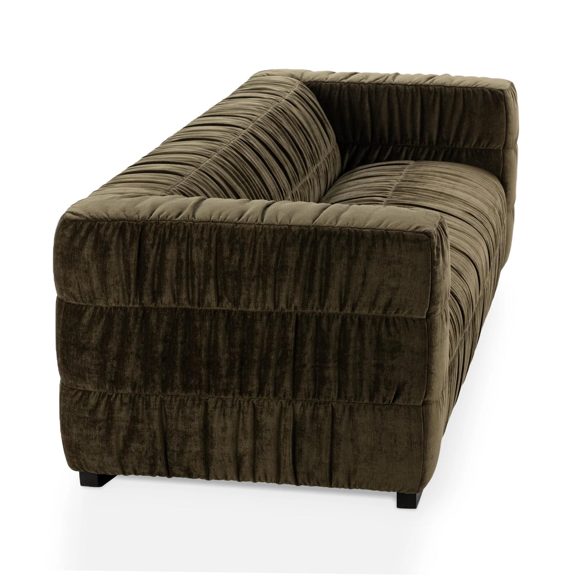 A dark olive green Ruched Upholstered Sofa with luxury fabric, deep channel tufting, and a low back is shown angled to display the back and side, set against a white background.