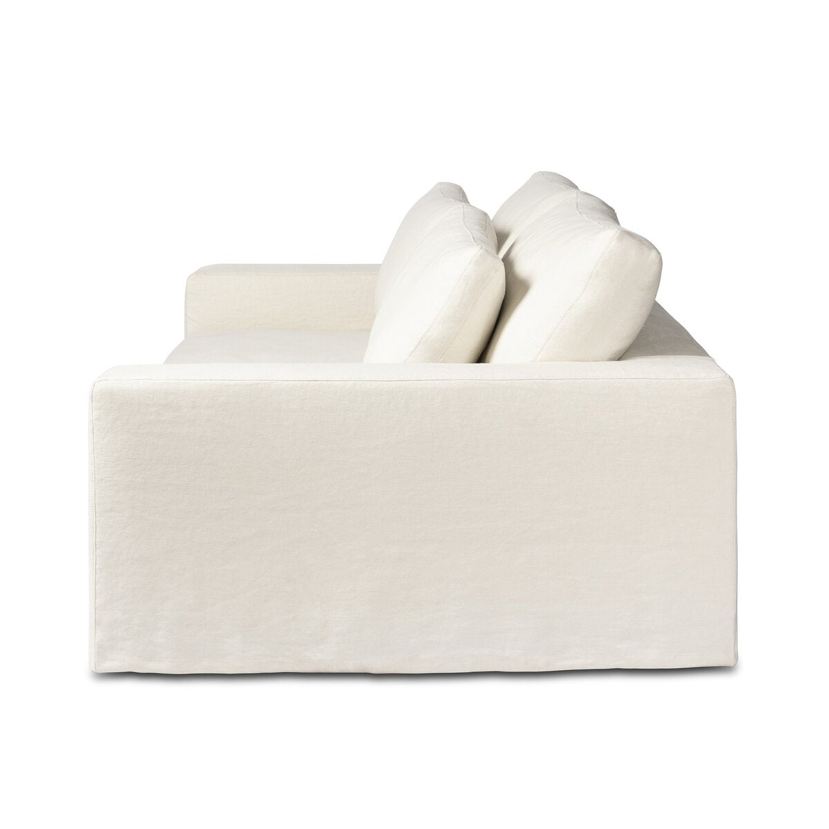 Side view of the Outdoor Slipcover Sofa in white, featuring two large back cushions, straight arms, and a clean, minimalistic design set against a plain white background.