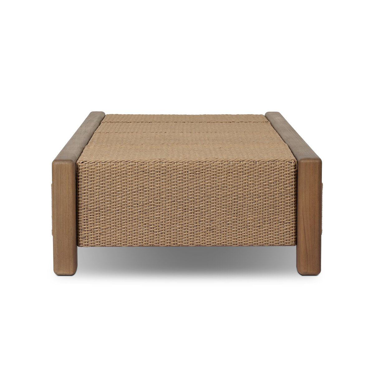The Herrick Outdoor Coffee Table features a rectangular woven rattan top and sides with solid wood legs and frame. Measuring 70"w x 35"d x 15"h, it stands out in any space, displayed here against a plain white background.