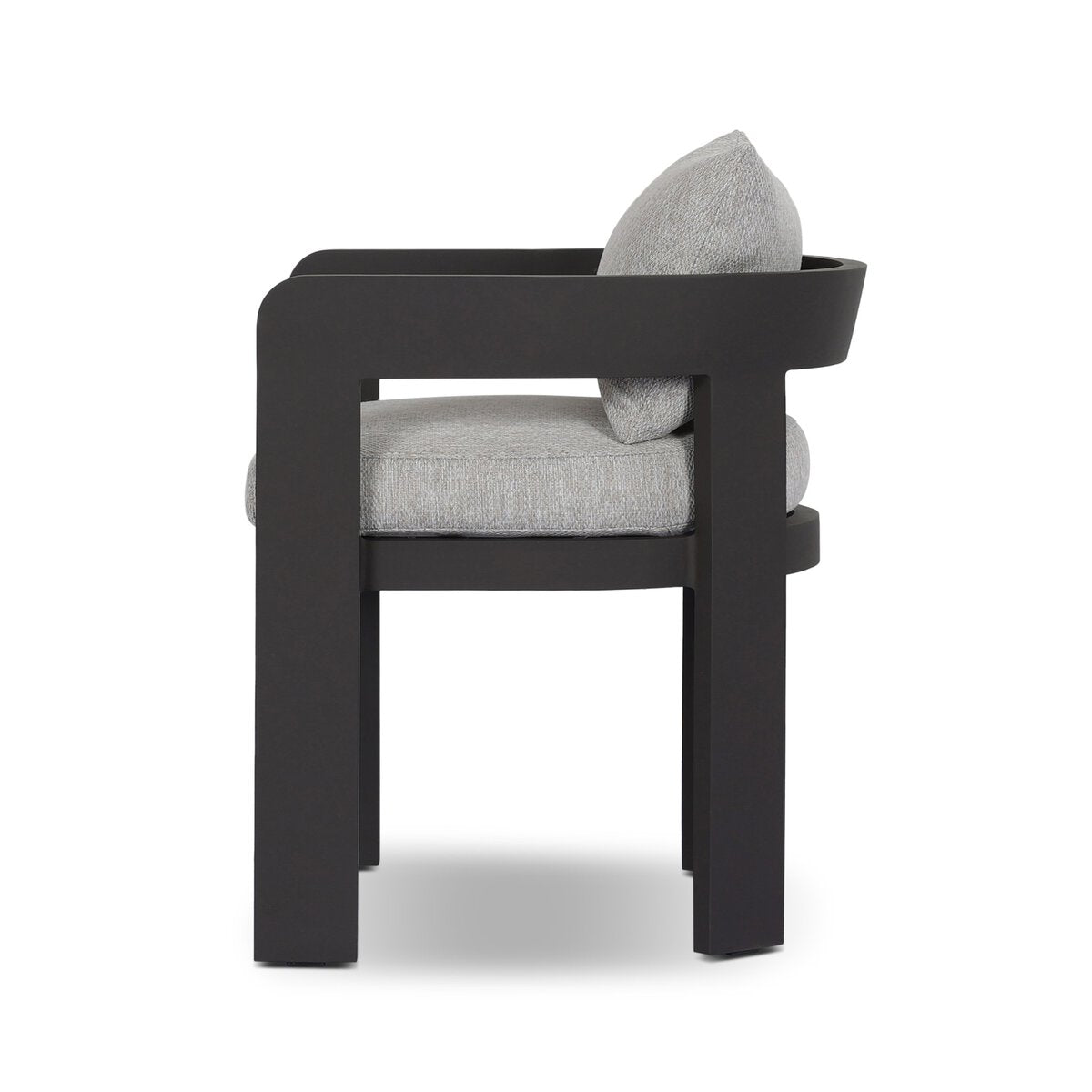 Side view of the Outdoor Metal Dining Chair featuring a thick, dark metal frame, curved backrest, and light gray cushioned seat. Its minimalist and contemporary design stands out against a white background.