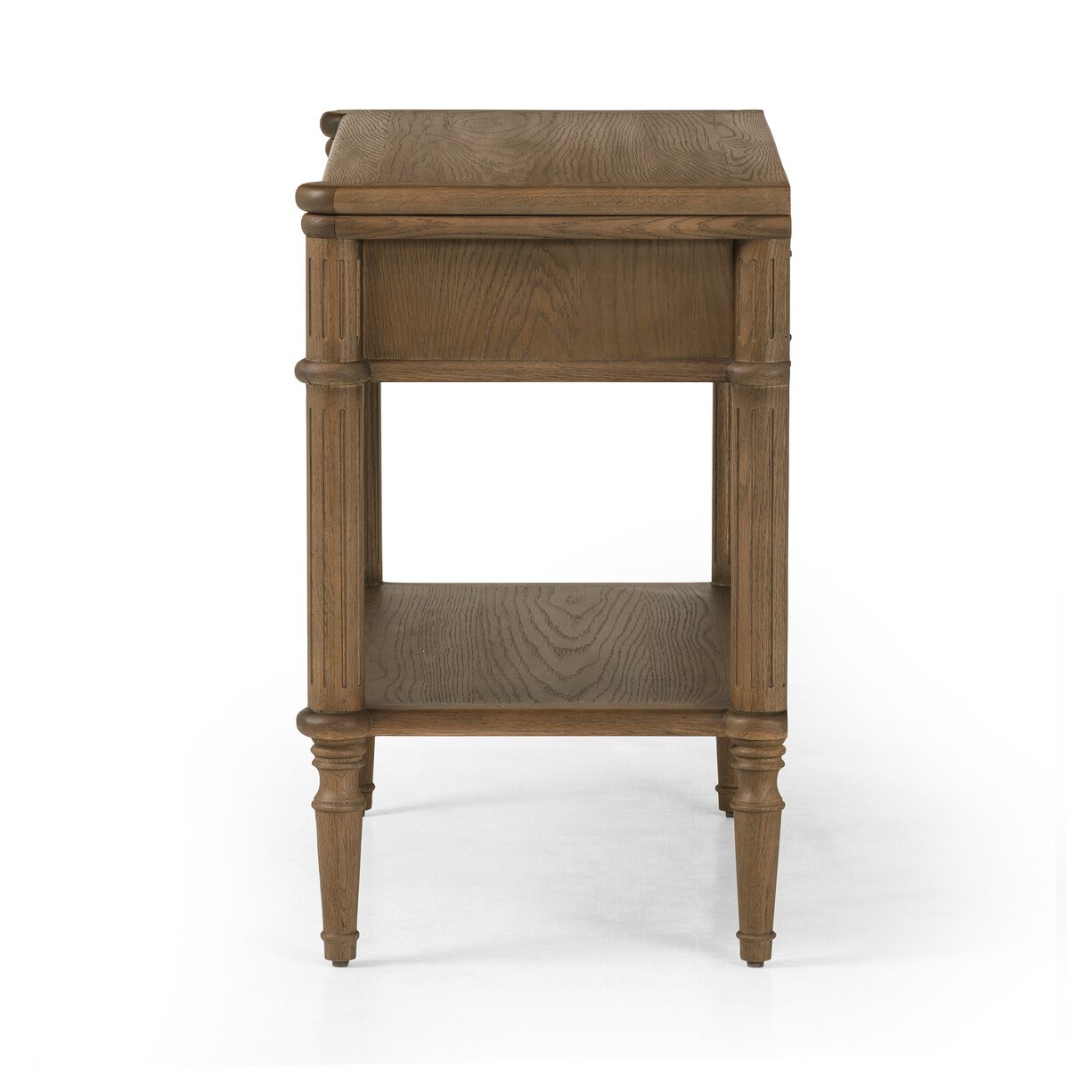 The European Nightstand, crafted from wood with tapered legs, a lower shelf, and a drawer, is shown in a side view against a white background.