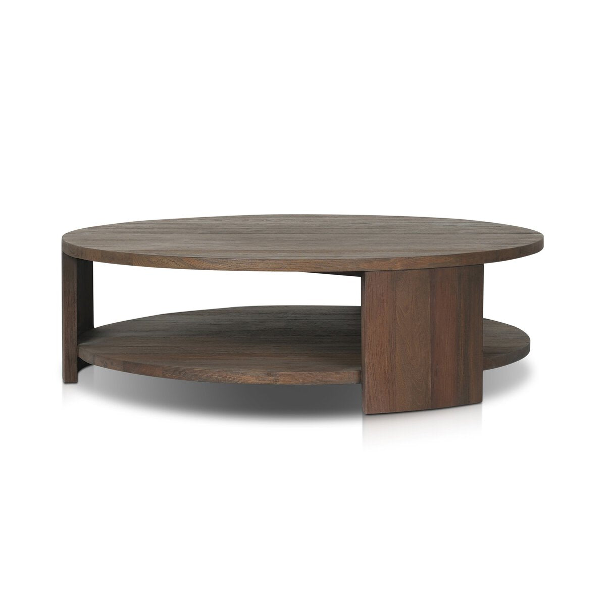The Outdoor Chunky Round Coffee Table features a smooth dark wood finish, thick legs, a lower shelf, and minimalist design, combining modern style with reclaimed wood for a stylish centerpiece. Shown on a white background.