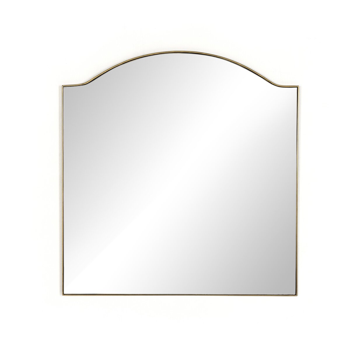 The Jacques Mirror is a decorative wall mirror with a square shape, thin metallic frame, and arched top, displayed against a white background.