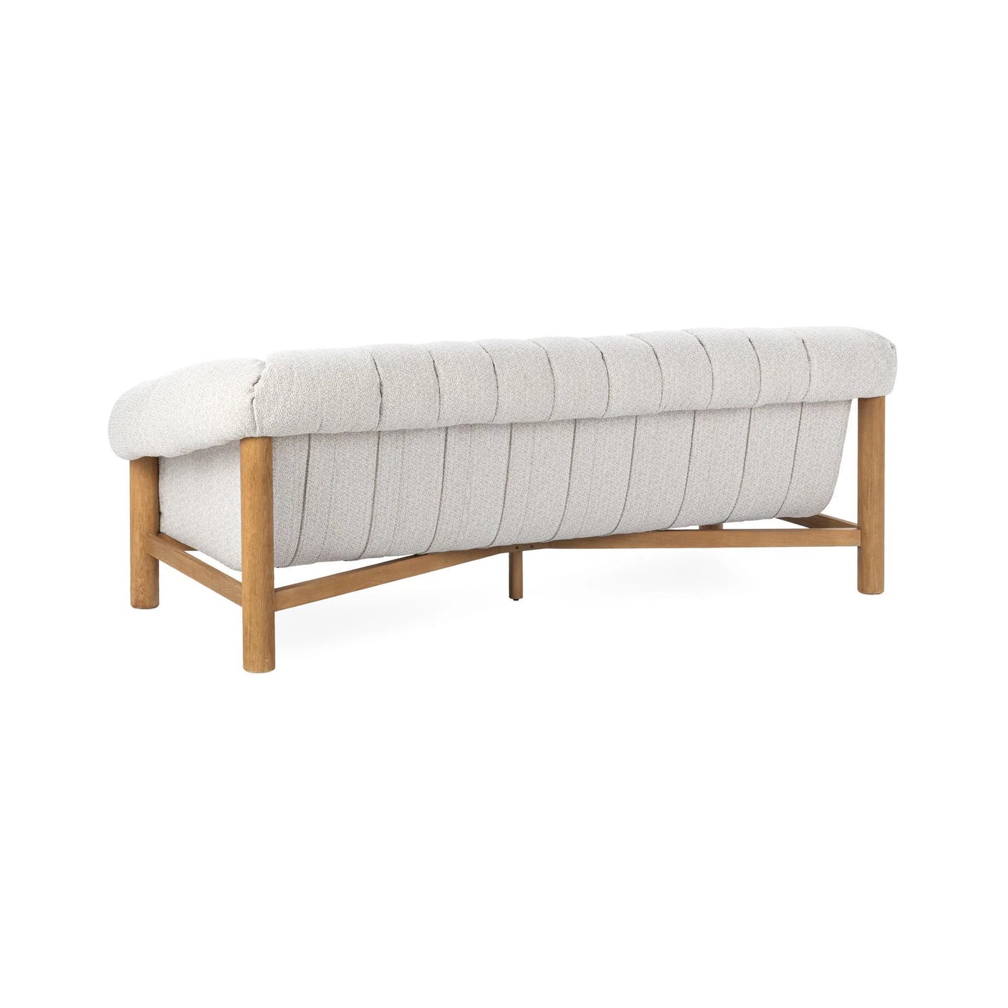 The Plush Upholstered Sofa features light gray polyester cushions, vertical tufting, and a brushed oak wood frame, displayed from the back at an angle.
