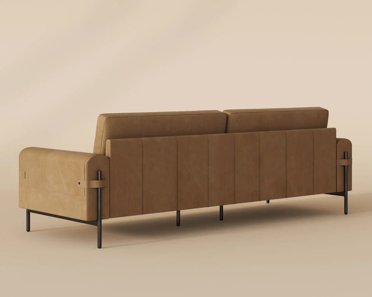 The Leather Strap Sofa in Sesame leather with metal legs is displayed from the back on a beige background, featuring a minimalist design, clean lines, subtle stitching, and luxurious top grain leather upholstery.
