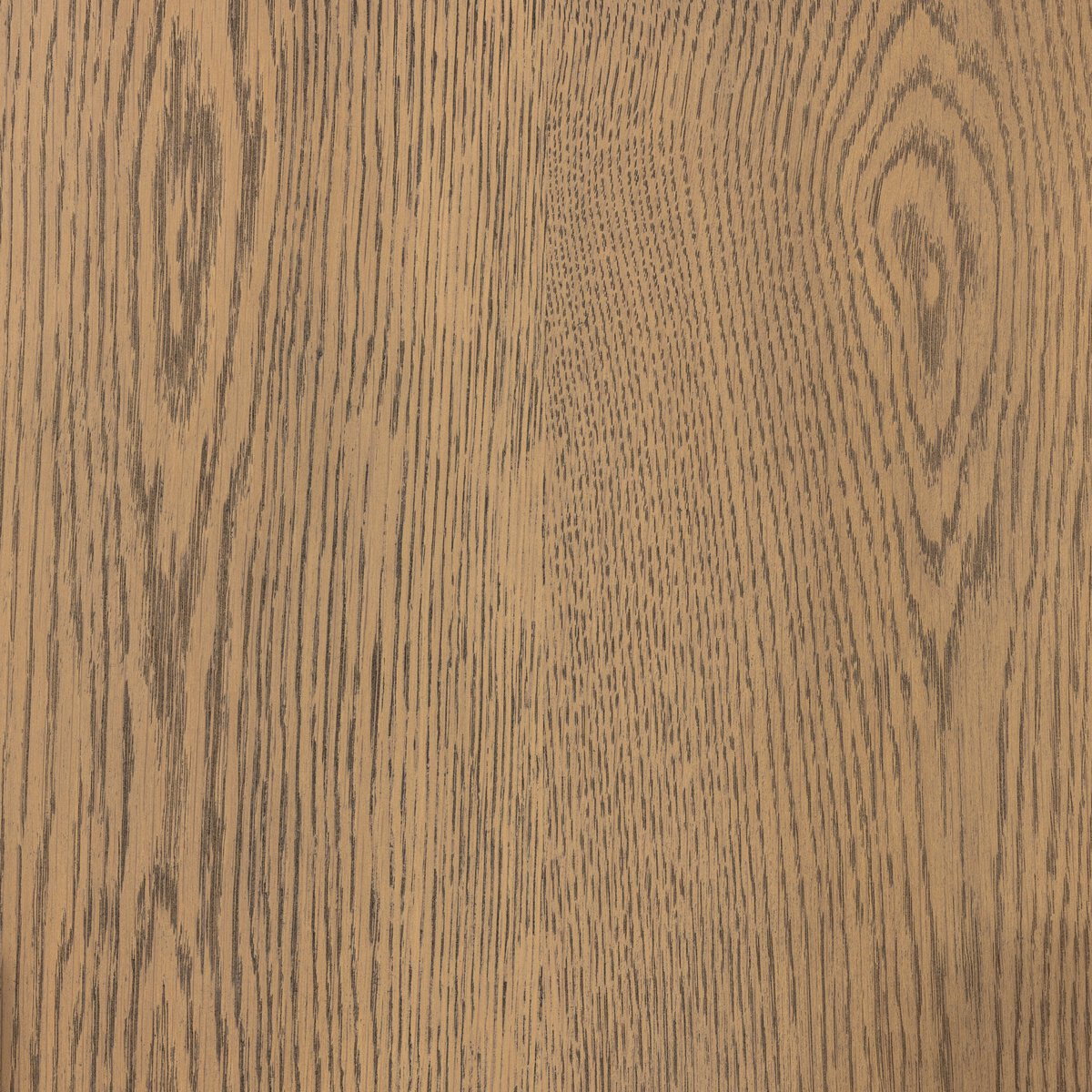 Close-up of the Cradle 6 Dresser Drawer in light-smoked oak, highlighting its natural wood grain with lines, swirls, and knots—a stylish, STURDY Act compliant choice for bedroom storage.