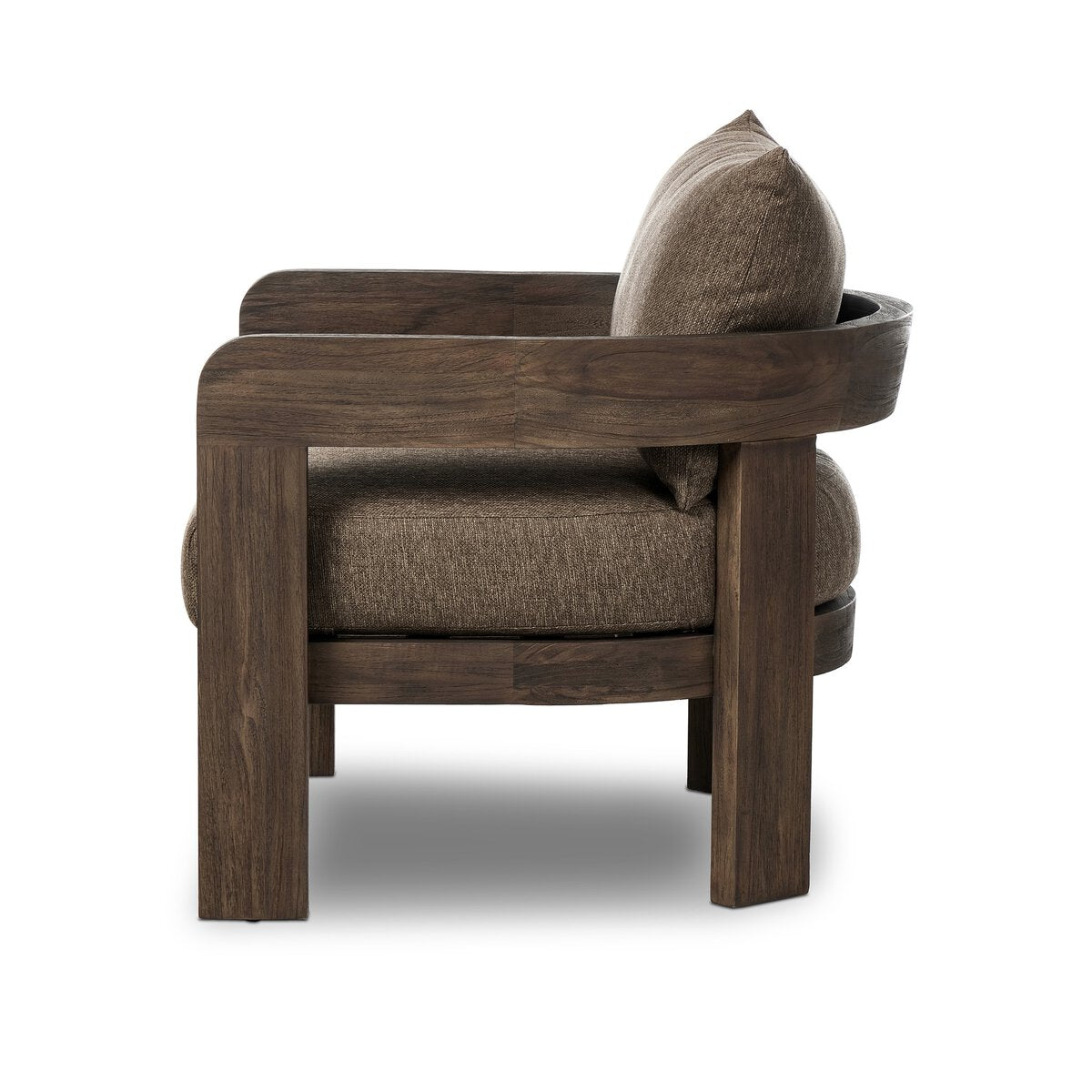 Side view of the Barrel Back Outdoor Chair, featuring teak framing, thick square legs, and plush, textured brown cushions on the seat and backrest, set against a white background.