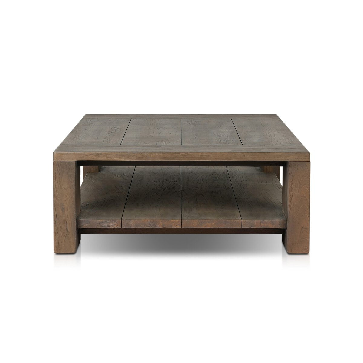 The Outdoor Chunky Rectangle Coffee Table features a rustic, plank-style design crafted from reclaimed teak wood with a natural brown finish, a lower shelf, thick legs, and a simple modern look.