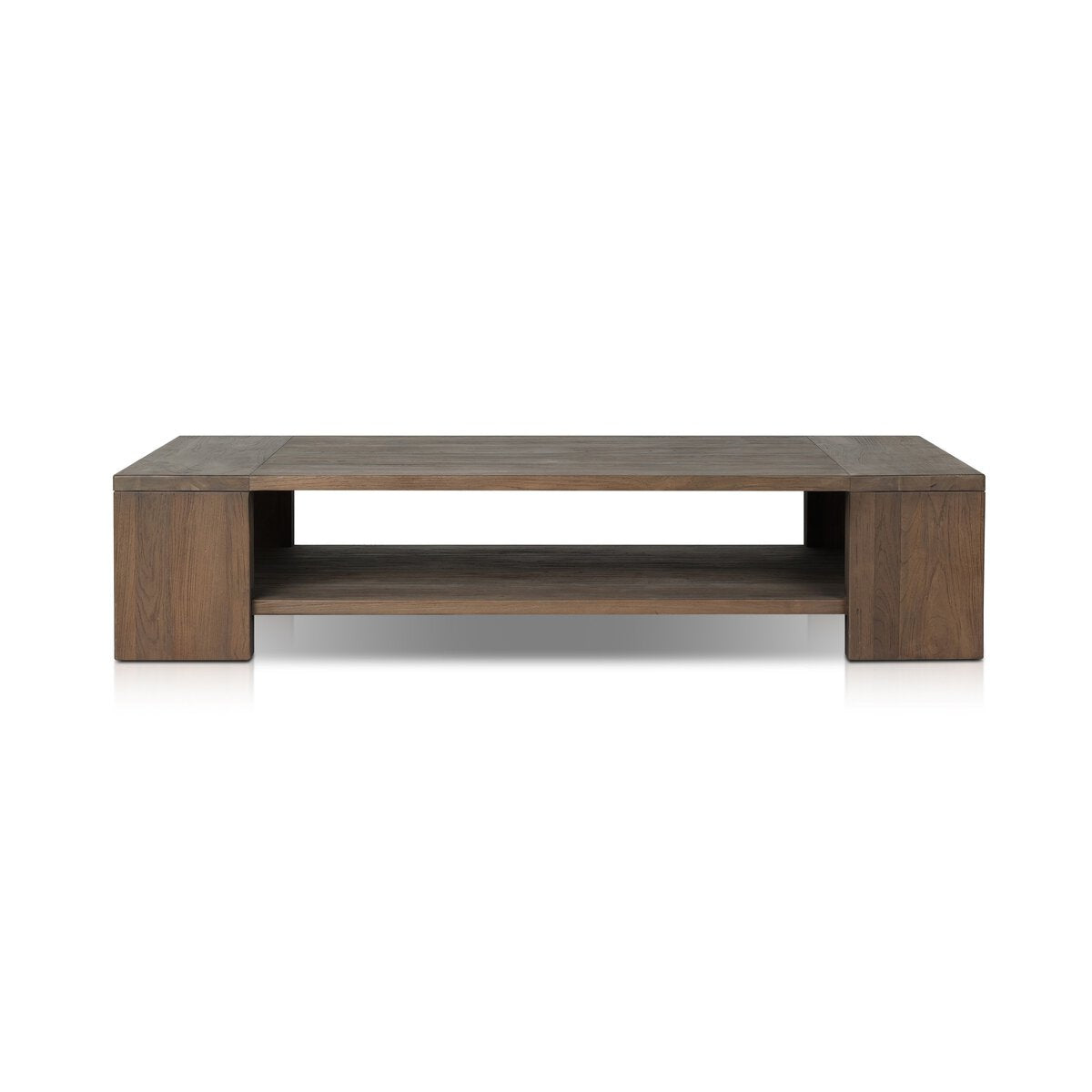 The Outdoor Chunky Rectangle Coffee Table is made from reclaimed teak wood with a wide, flat top, thick legs, and an open lower shelf. Its dark natural finish contrasts beautifully against a plain white background.