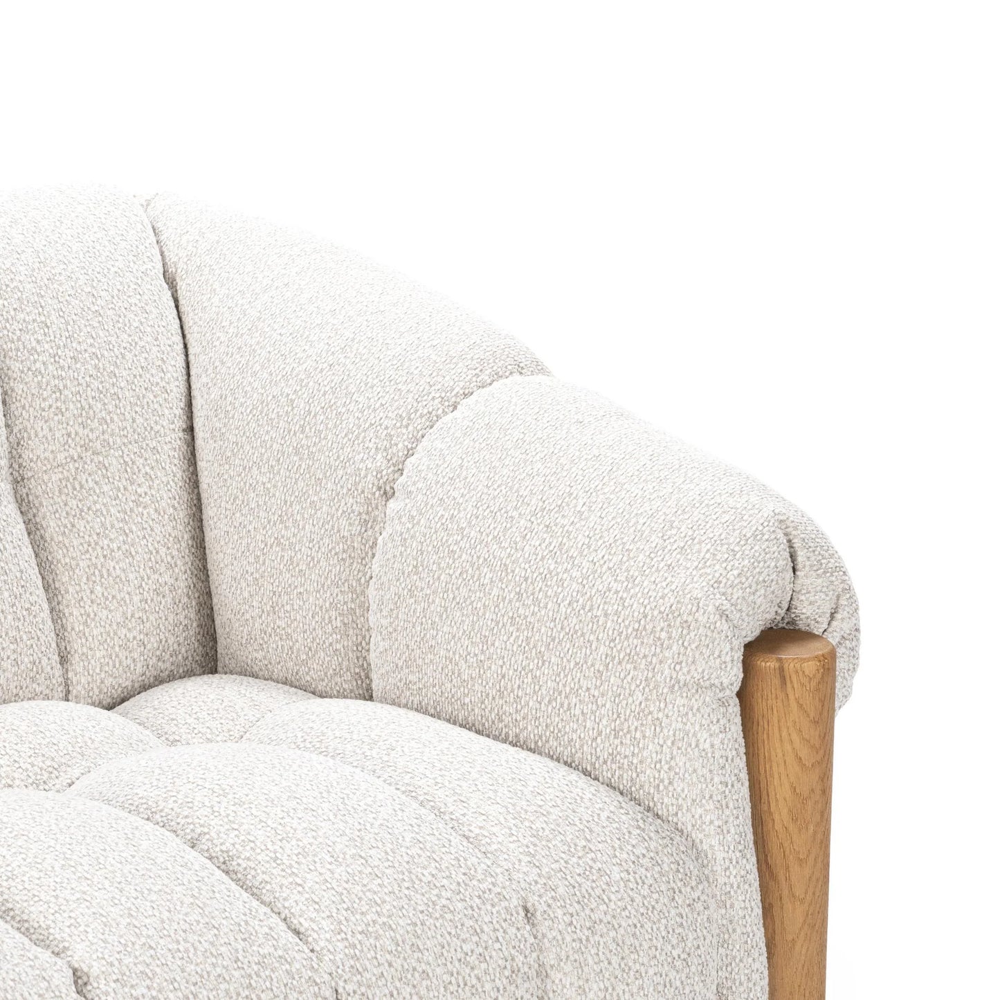 Close-up of the Plush Upholstered Sofa in textured light beige polyester fabric with a rounded, plush backrest and smooth brushed oak wood accent on the armrest, set against a plain white background.