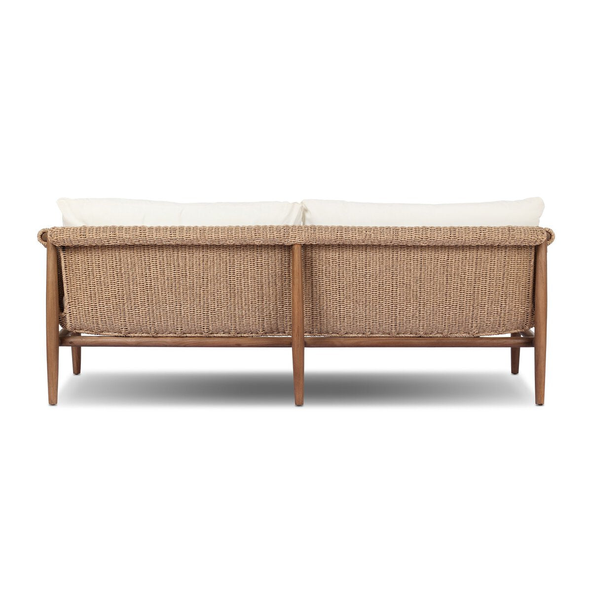 The Woven Outdoor Sofa features a vintage-inspired wooden frame, woven faux hyacinth detailing, and two white seat cushions, shown here from the back view.