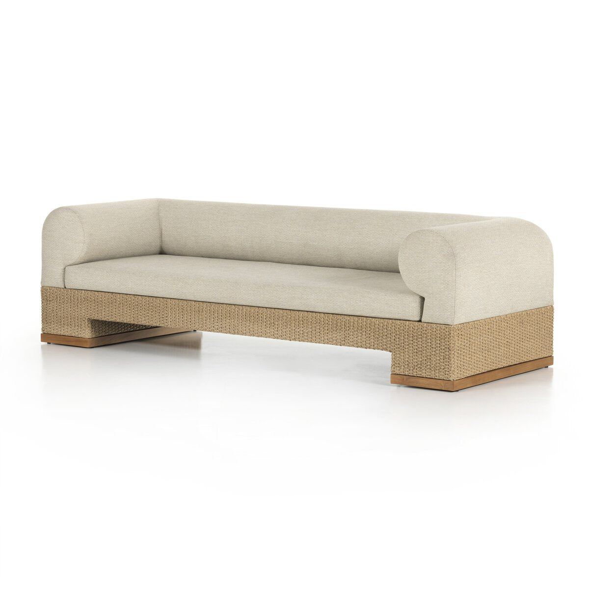 The Wicker Base Outdoor Sofa features a modern beige design with rounded arms, a wide seat, and a wicker base on wooden feet, shown against a white background.