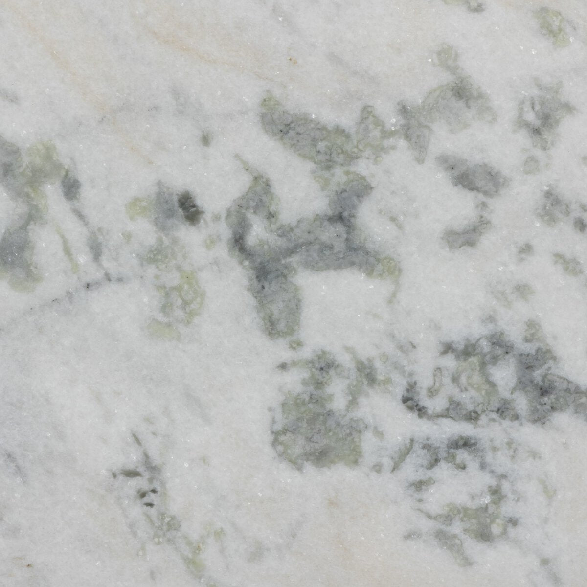 Close-up of the French Nightstand’s white marble top, featuring light gray and greenish veins that highlight the natural, textured stone used in its vintage solid mango wood design.