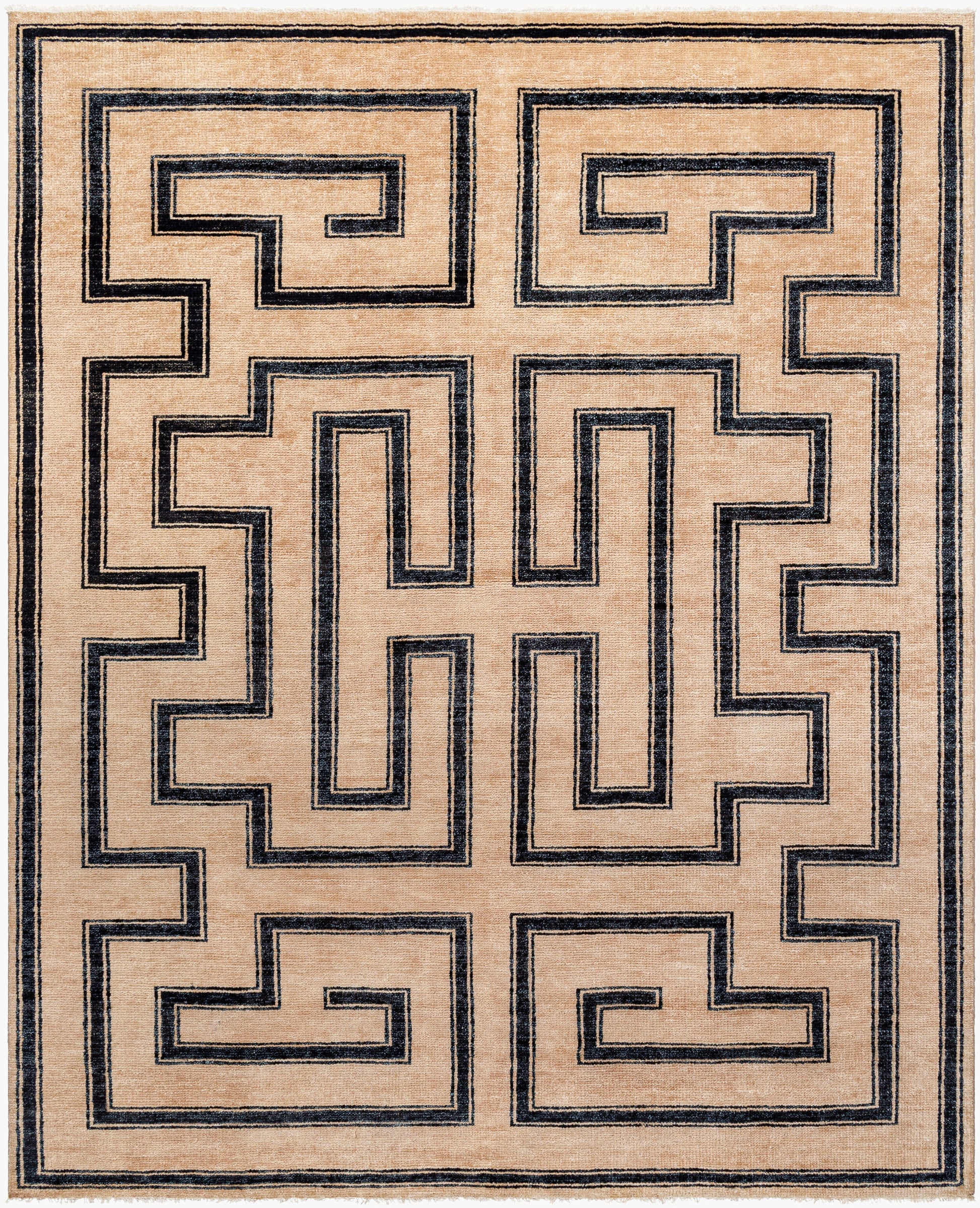 The Ivory/Black Geometric Maze Rug - 8' x 10' features a rectangular beige design with bold black maze patterns of repeating right angles and rectangles, bordered by thin black lines.