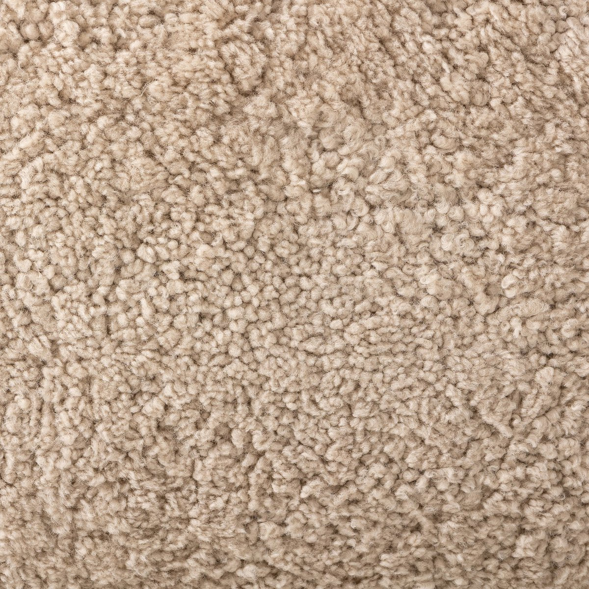Close-up of the Shearling Accent Chair in beige, highlighting its upholstered, textured fabric with soft and dense fibers for a plush and cozy look.