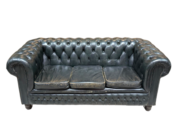 The Vintage Dark Sea Green Chesterfield Sofa features vintage-style leather, deep button tufting, rolled arms, and three seat cushions. At 73 inches wide with slight wear, this classic piece stands out against a white background.