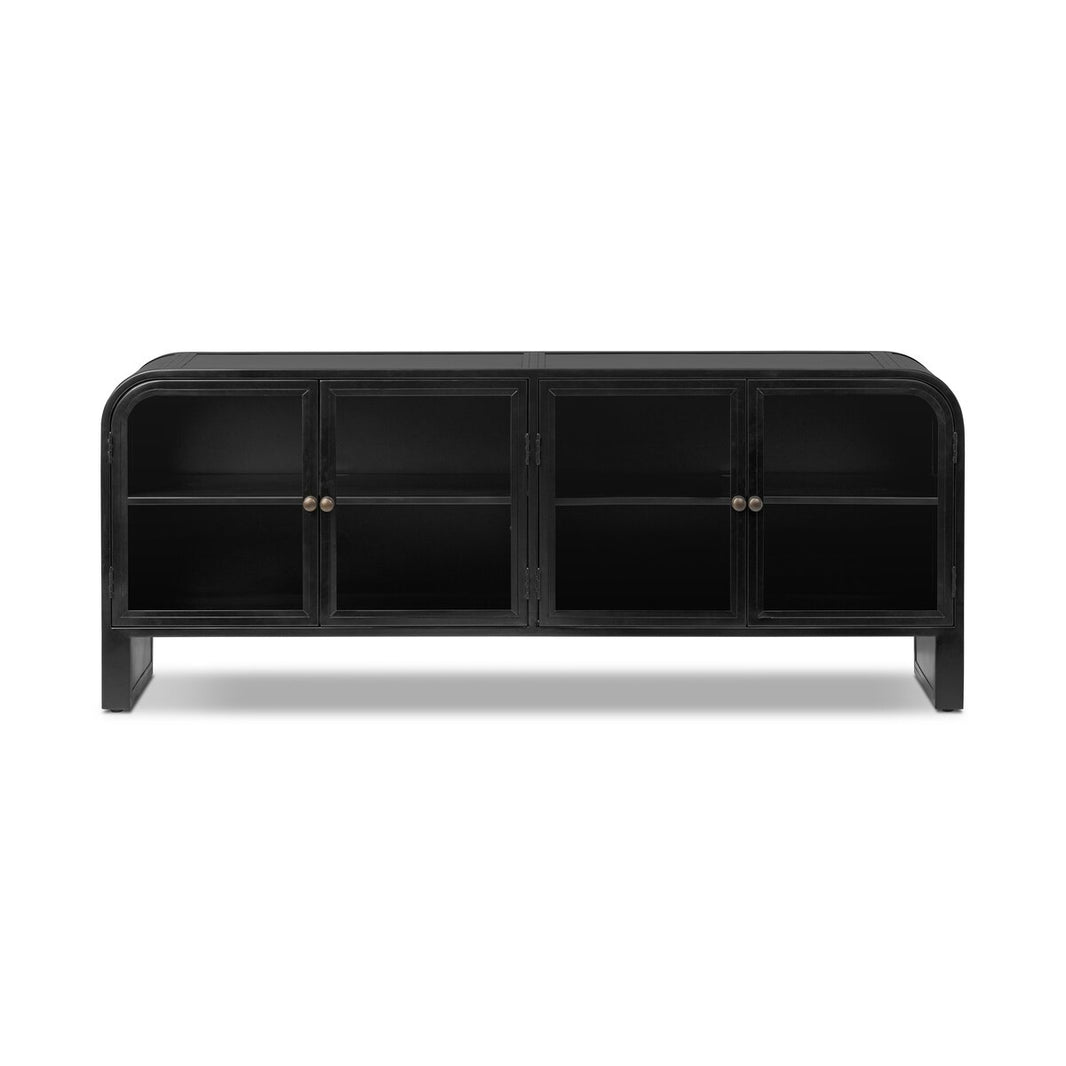 The Iron Media Console features a black wood finish, four glass-paneled doors with rounded corners, and two metal knobs per pair. Multiple interior shelves provide organized media storage.
