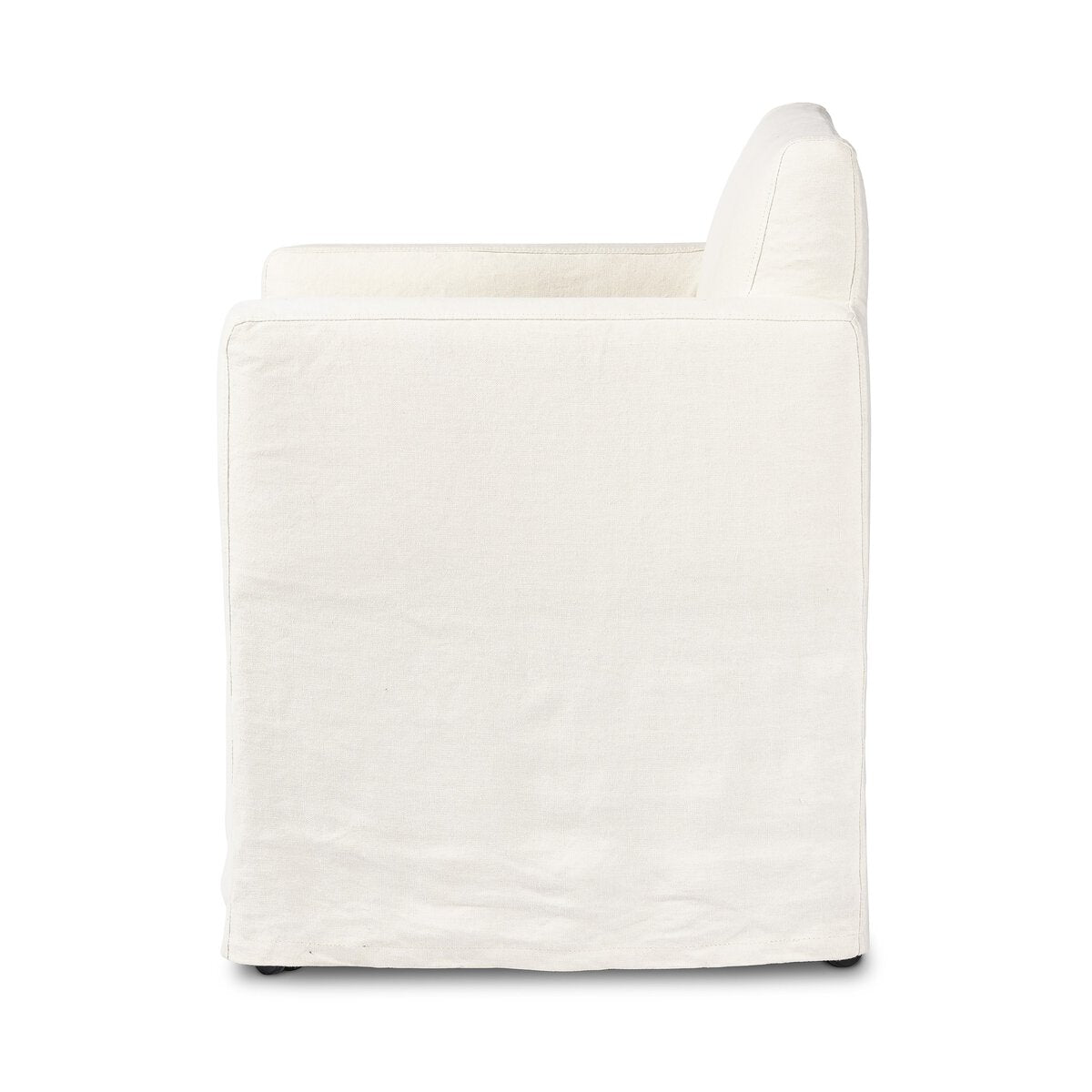 Side view of an Outdoor Slipcover Dining Chair featuring a simple, boxy design and washable white hemp upholstery in a slipcover style, set against a plain white background.