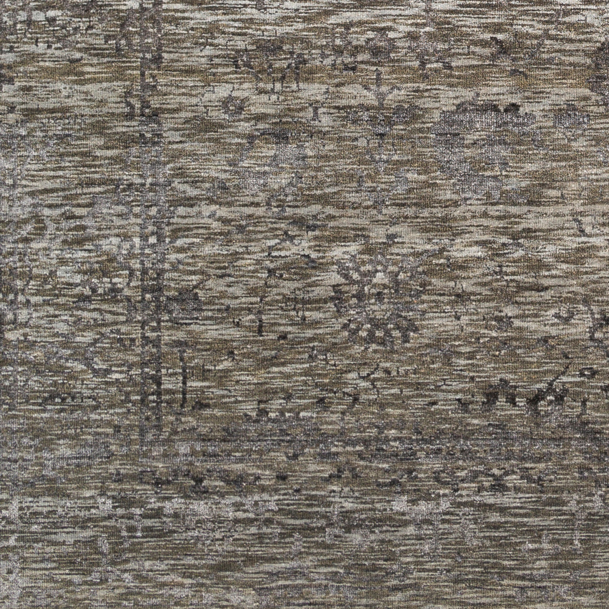 A close-up of the Low Pile Wool/Viscose Rug (8'x10') shows a textured, weathered surface with muted earthy tones and abstract patterns resembling aged wood or stone, plus subtle floral and linear designs in various sizes throughout.