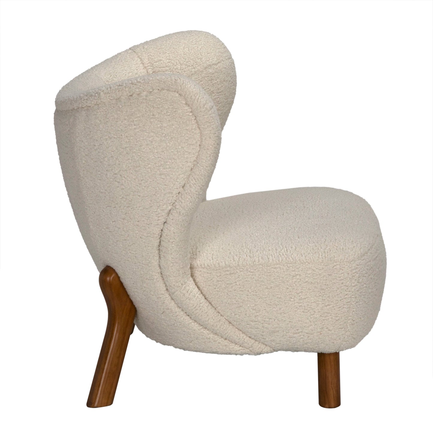 Side view of the Sherpa Occasional Chair featuring light beige textured fabric and two wooden legs—one angled at the back, one vertical in front. Dimensions: 31W x 30D x 31H. Shown against a plain white background.