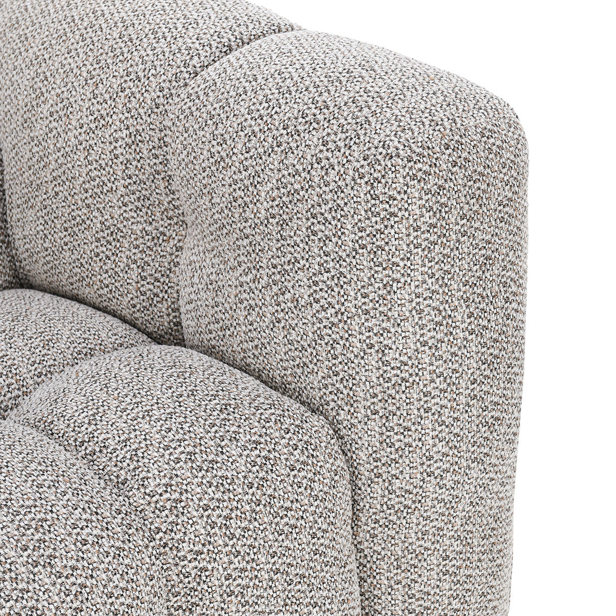 Close-up of the corner of the Biscuit-Tuft LAF Sectional in heathered gray, featuring textured fabric, tufted upholstery, and soft, rounded edges.