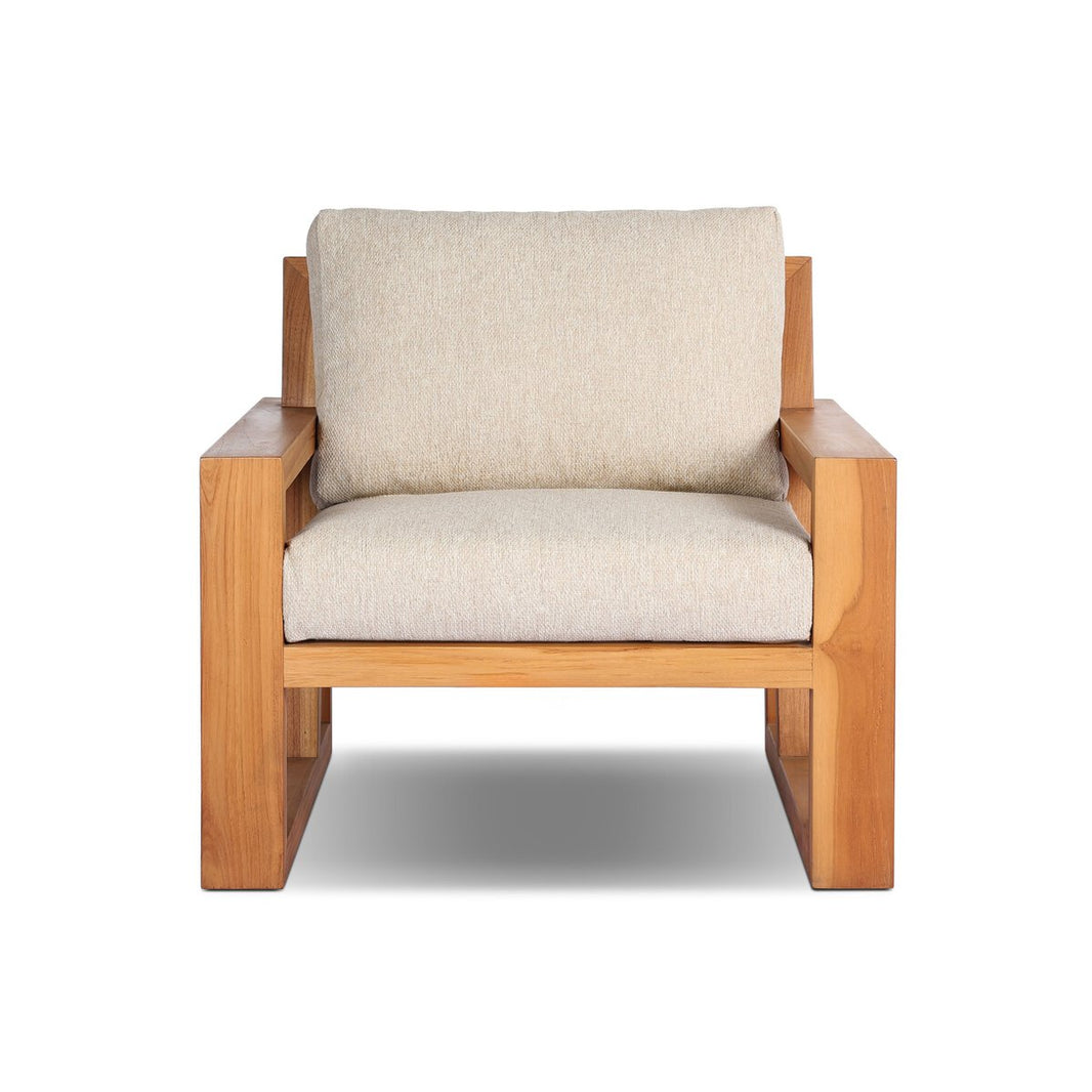 The Nordic Teak Outdoor Chair features a sturdy wooden frame, wide armrests, and light beige cushioned seat and backrest, offering durable comfort. Shown from the front against a white background in minimalist Nordic style.